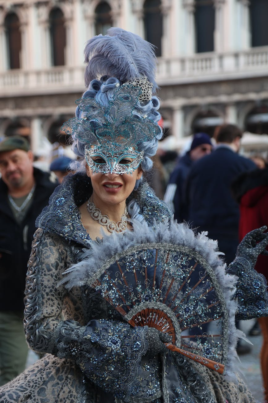 a woman in a fancy costume and mask
