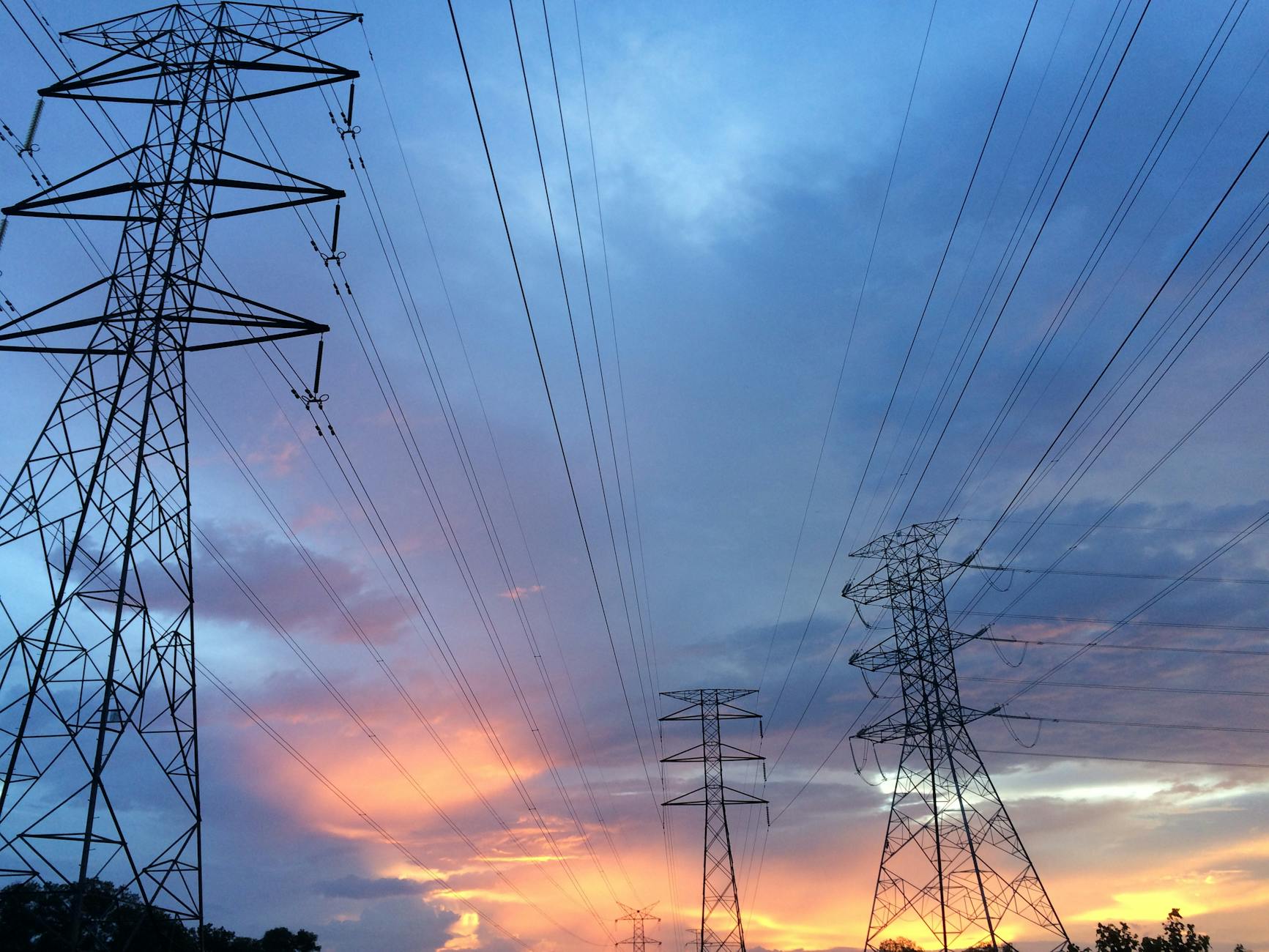 transmission tower under gray sky