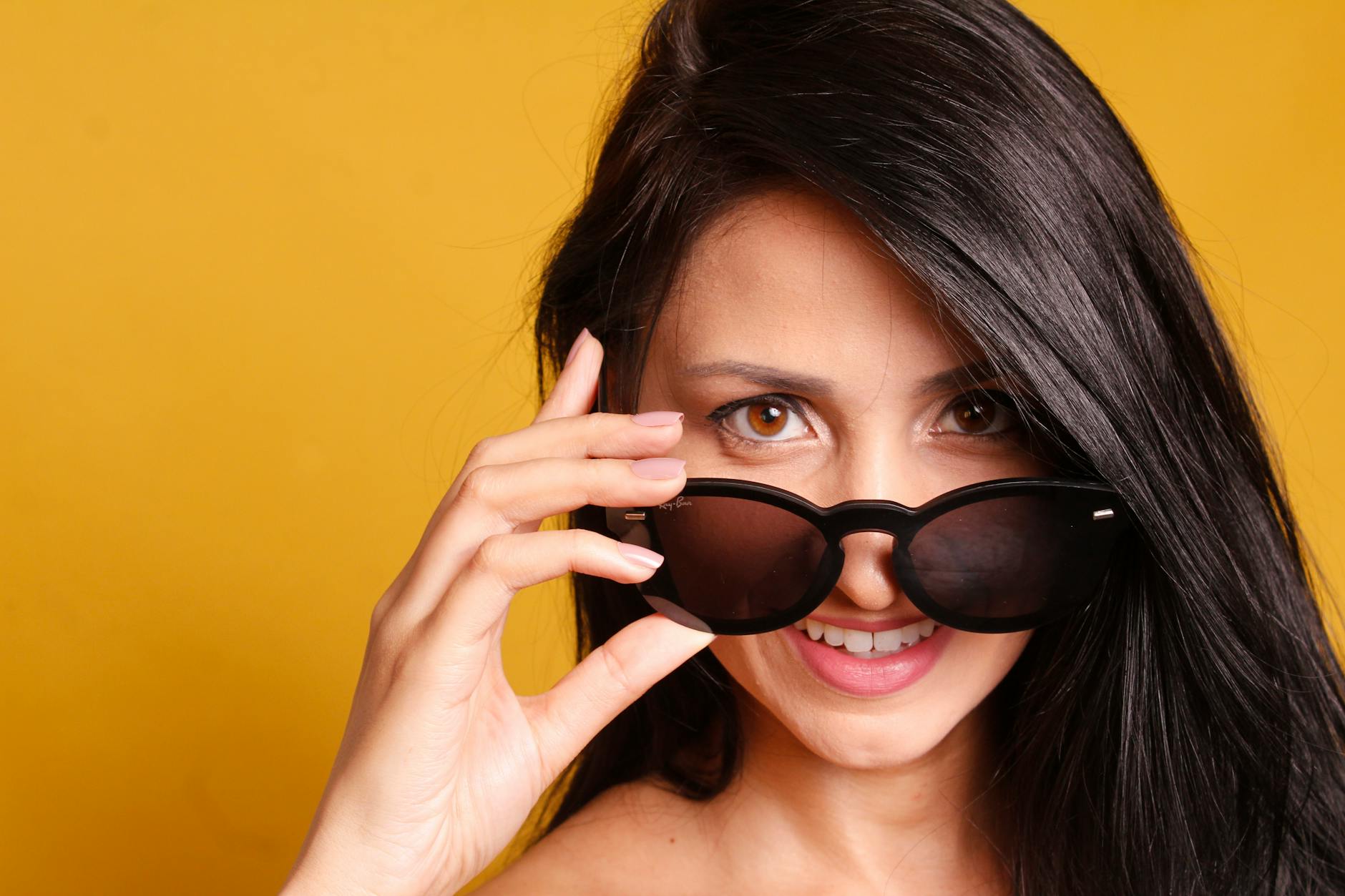 smiling woman wearing black sunglasses