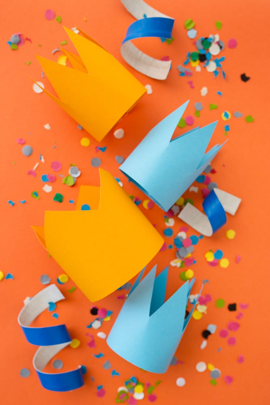 paper cutouts over an orange surface